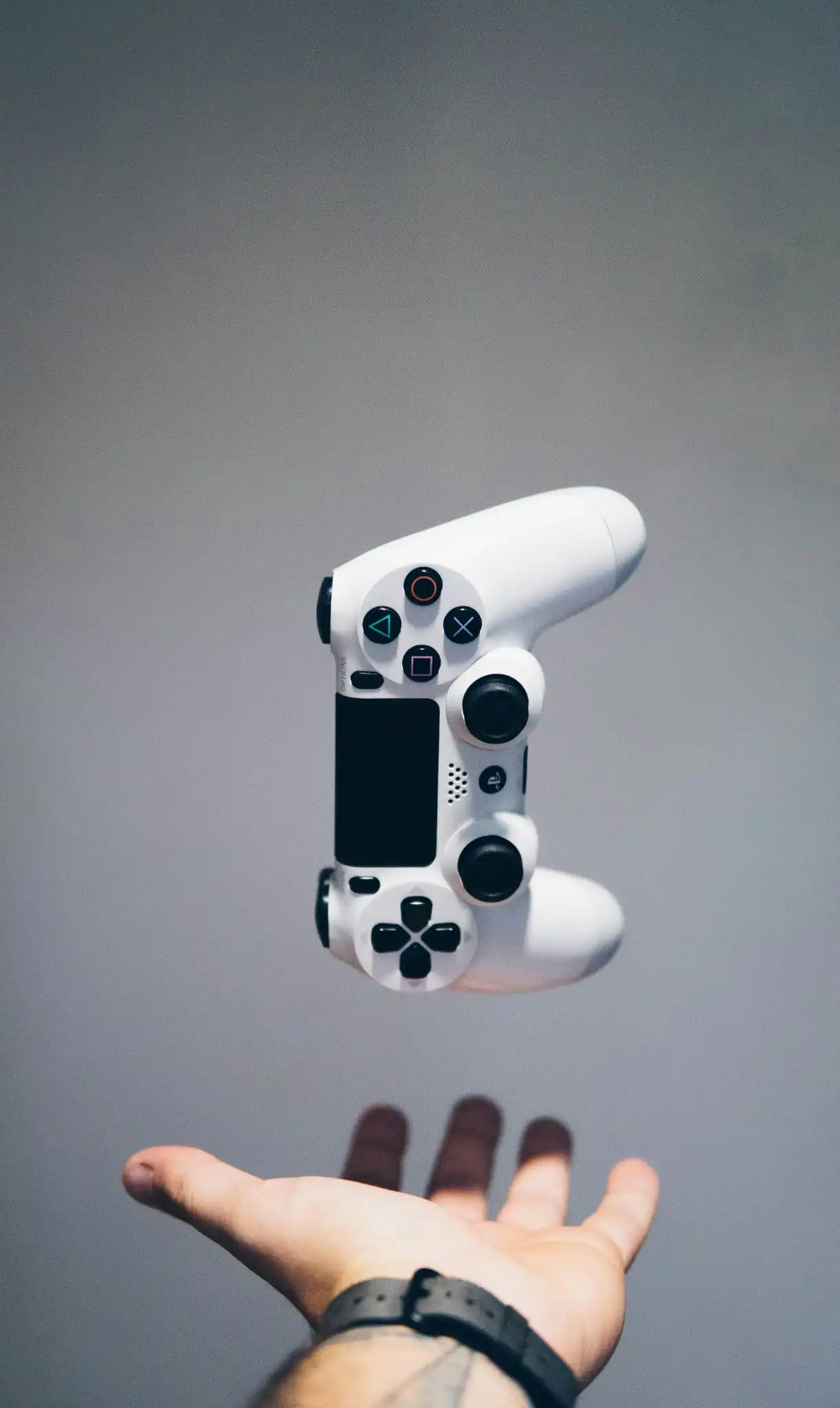Floating white PlayStation controller
