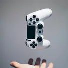 Floating white PlayStation controller