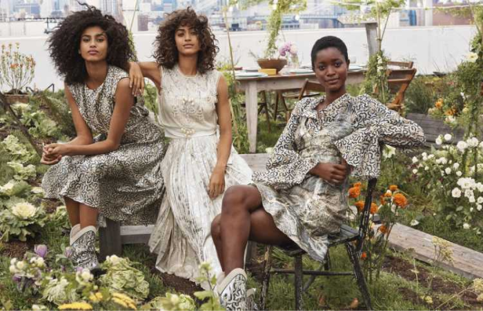 Three women in a garden wearing H&M clothes made of pineapple leather 