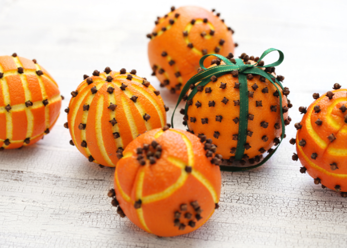 Carved pomander ball with cloves