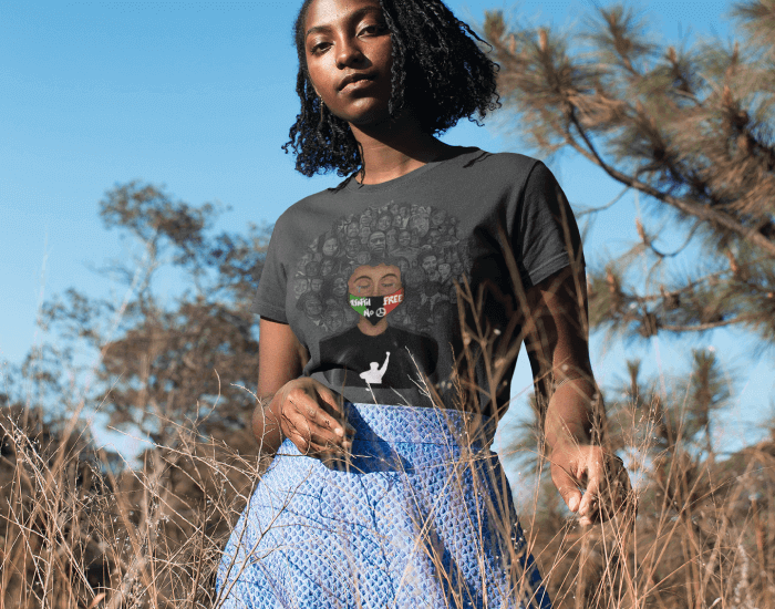 African American Woman in a Field Posing in the Seed2shirt Clothes