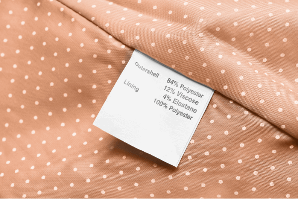 label on a piece of clothing indicating it contains polyester viscose elastane