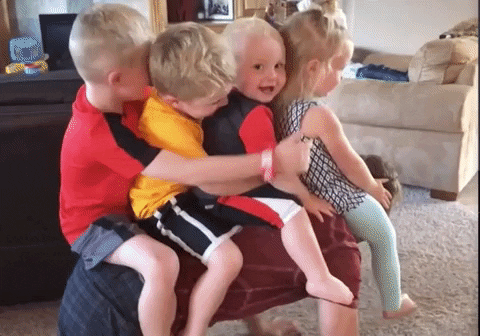 playful dad, father playing with his four kids GIF