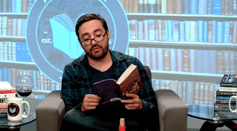 stay-at-home dad type, a man reading a book and talking GIF